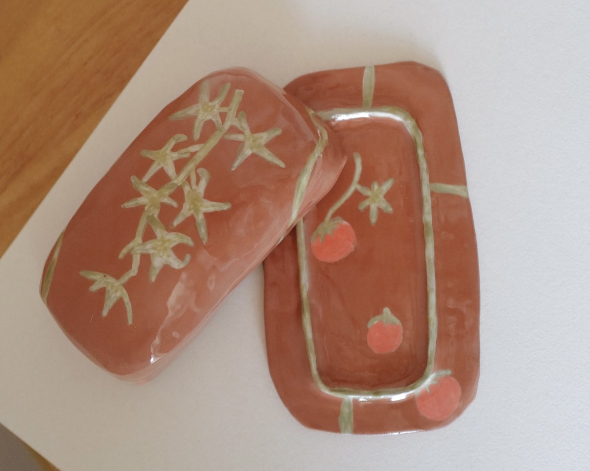 Butter dish lid and tray showing painted cherry tomatoes