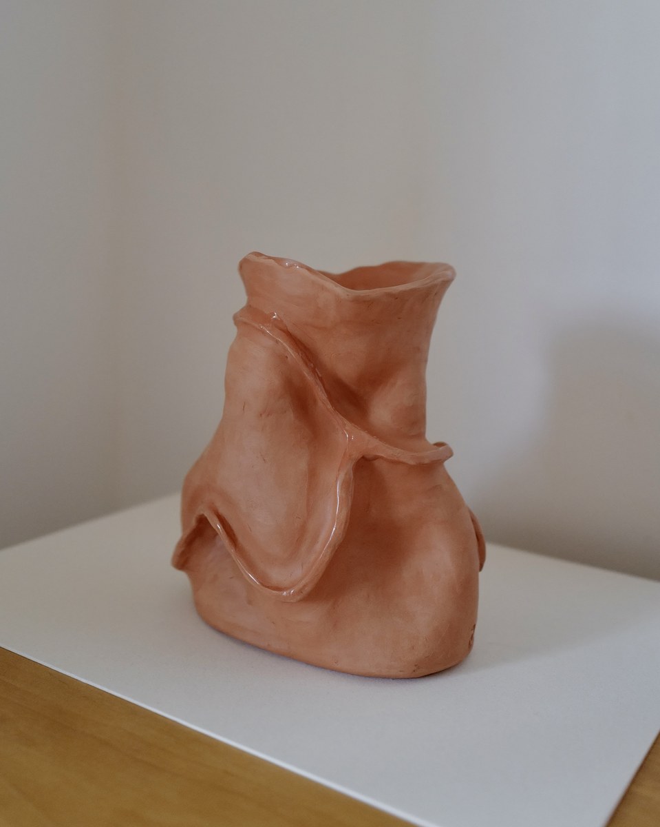 Organic hand-built terracotta vase, side view