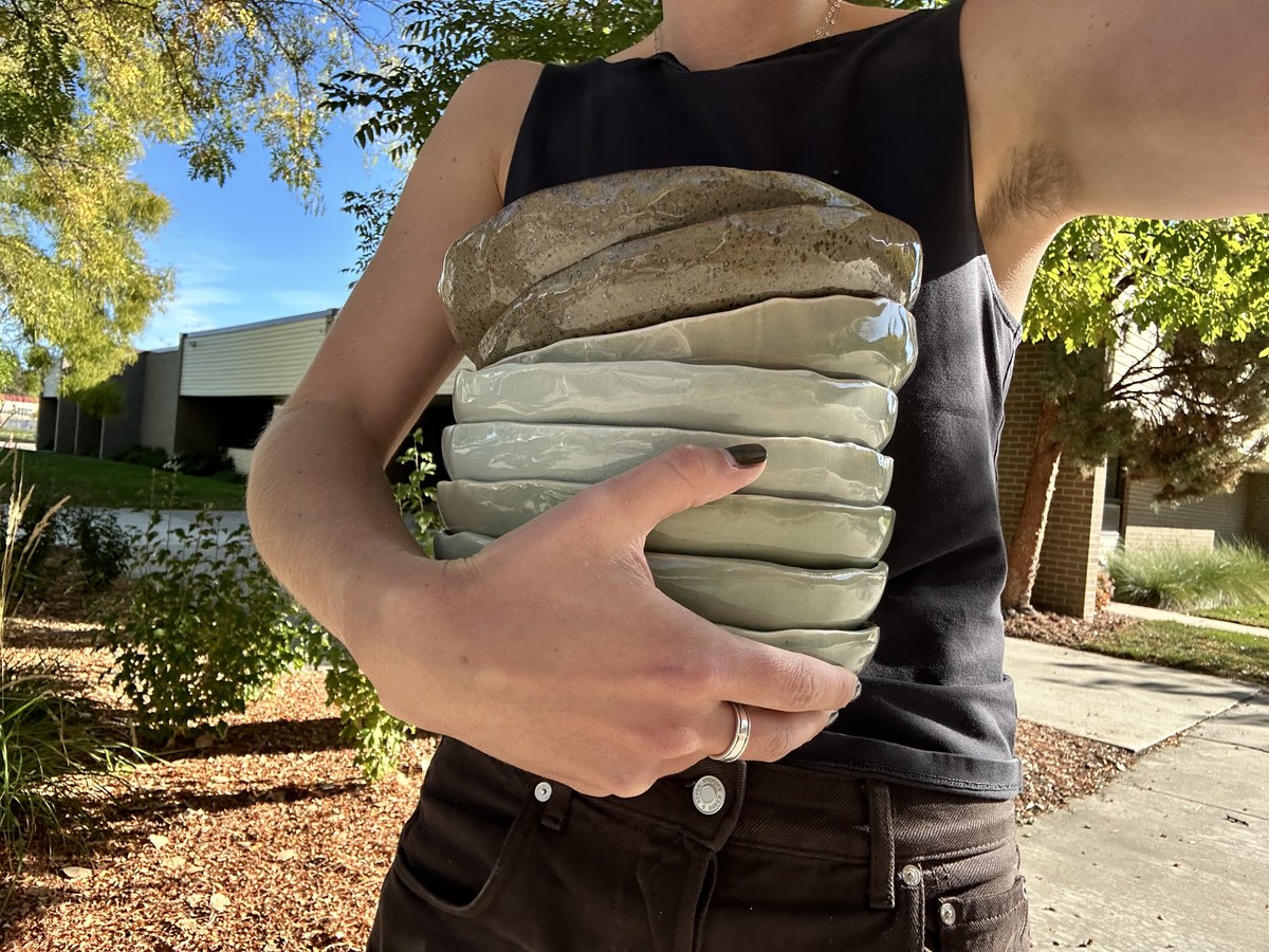 Stack of graduated ombre-glazed dishes