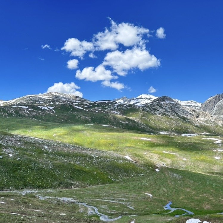 Alpine valley with snow-capped mountains
