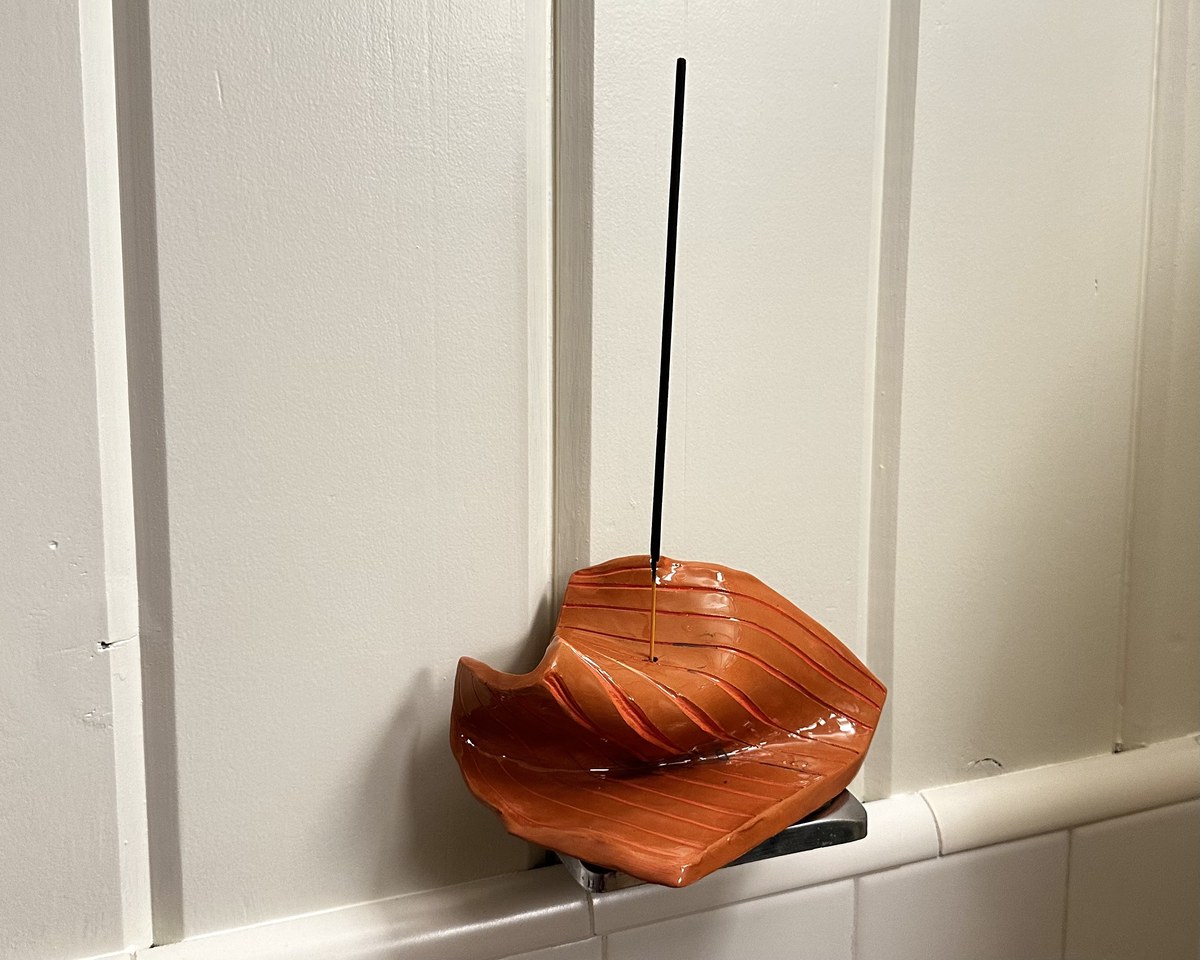 Leaf-shaped orange incense holder