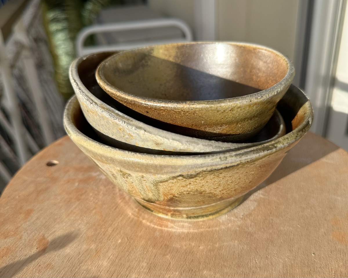 Two wood-fired bowls nested, table view