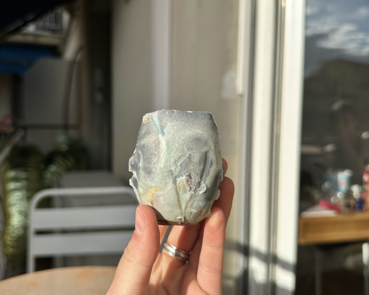 Small wood-fired cup with pale blue-grey ash glaze